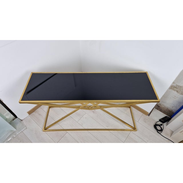 Console Table in Brass-Plated Iron and Black Glass Top, in Very Good conditions. Designed from 2000