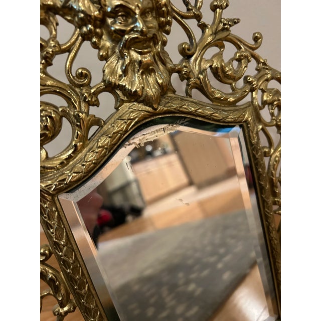 Antique brass vanity or wall hanging mirror, signed P. E. Guerin, NY in upper left corner of the reverse, c. 1890....