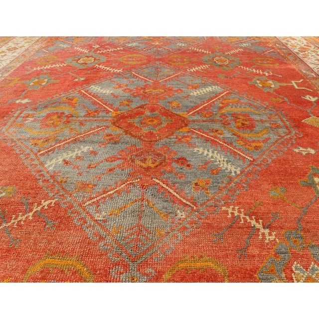 Early 20th Century Antique Turkish Oushak Rug With Tribal Medallion Design in Terracotta and Blue 10'0 X 13'8 For Sale - Image 5 of 12