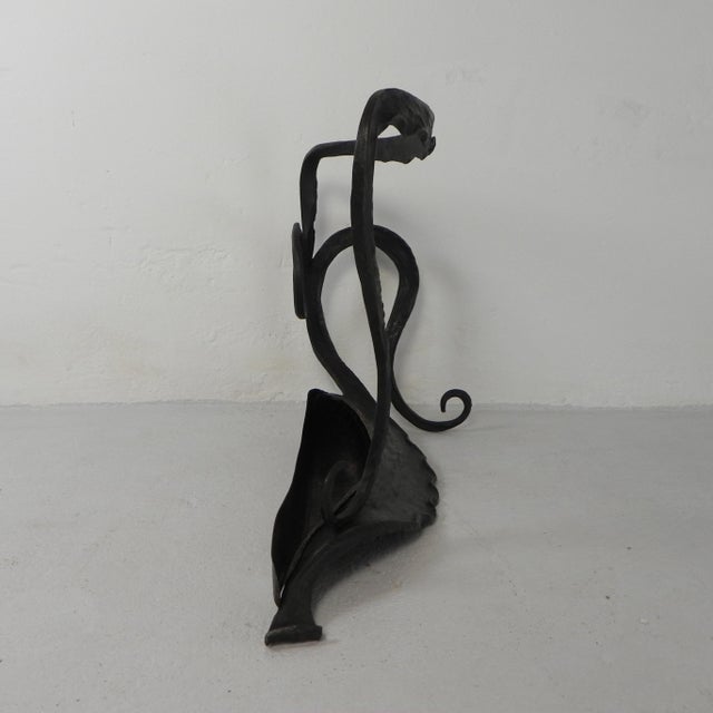 Exceptional Art Nouveau umbrella stand from the 1920s, hand-forged from steel with a copper bowl. The graceful lines and...