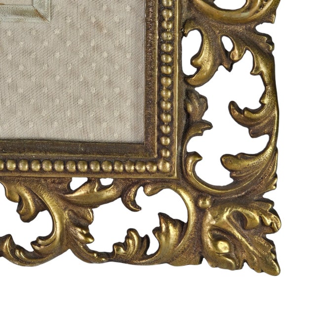 This utterly gorgeous cast metal portrait frame is so very ornate and gold. The frame's detailing exudes an air of "the...