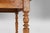 A soulful example of 19th‑century French rural craftsmanship, this elm wood dining table from around 1850 embodies the...