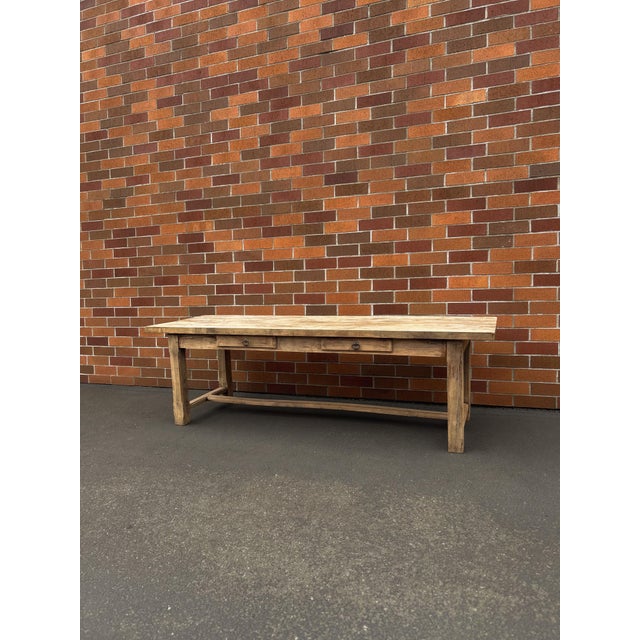 Bleached 19th-century oak farmhouse table sourced from Avignon , France. This large rectangular table seats six...