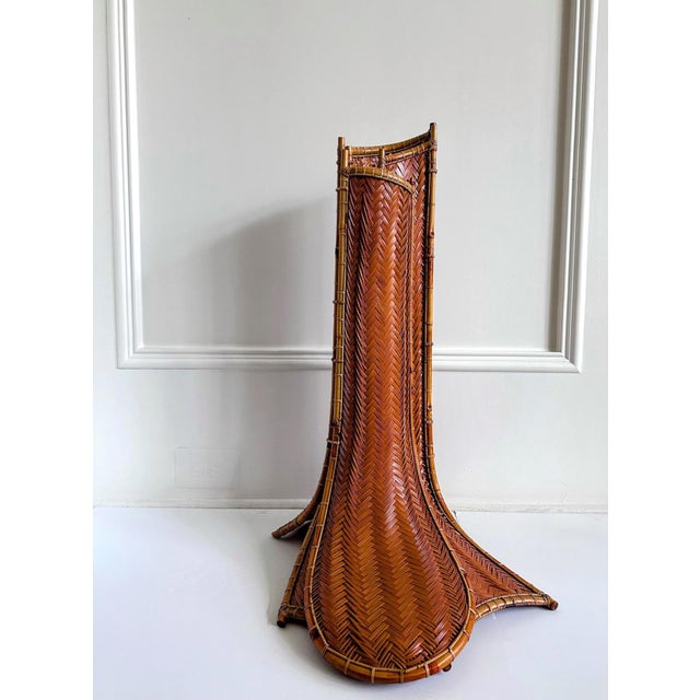 A tall and striking woven bamboo sculpture by Japanese bamboo artist Honma Hideaki (b. 1959) made in 1996 and originally...
