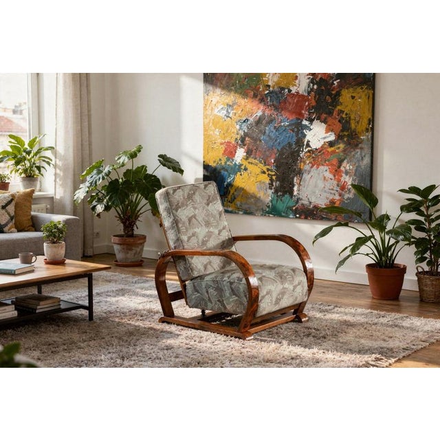 This reclining upholstered armchair is an exceptionally comfortable and elegant example of Czech furniture design from the...
