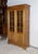 Beautiful massive cherry library, opening by two glass doors with 2 thirds. The lower part is full and paid. This piece of...