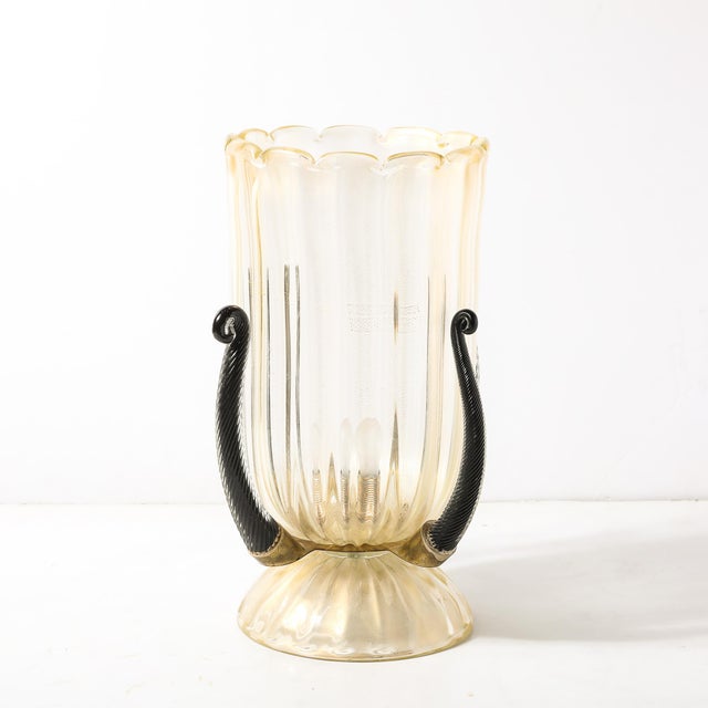 This exquisite pair of Mid-Century Modernist uplights showcases the masterful artistry of Murano glassmaking. Hand-blown...