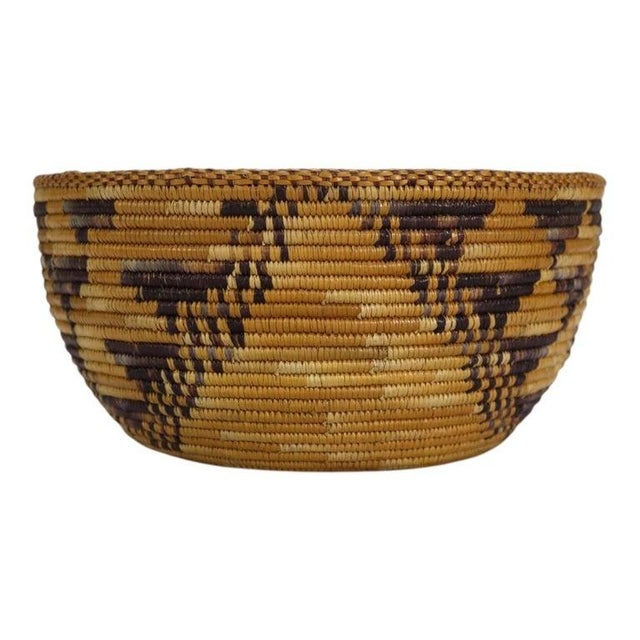 A finely crafted Southwest Native American basket, attributed to the Navajo, dating to approximately 1910. This coiled or...