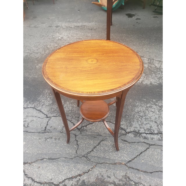 An exquisite George III Style Inlaid Mahogany center table or Side Table with lower tier stretcher joining the the 4 legs...