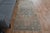 Vintage Hand-Knotted runner rug is a semi-antique vintage area rug. The '70s Eastern region of Anatolia's unique rug is...