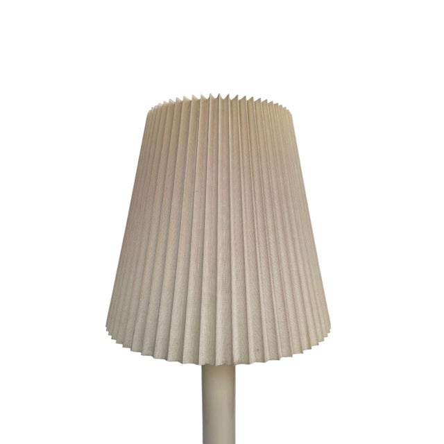 Fabulous Post Modern table lamp in the color ivory. Offers an enamel base and original pleated shade.