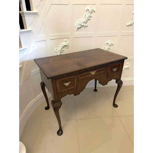 Large antique queen anne quality walnut lowboy having a quality rectangular shaped walnut top with herringbone inlay and a...