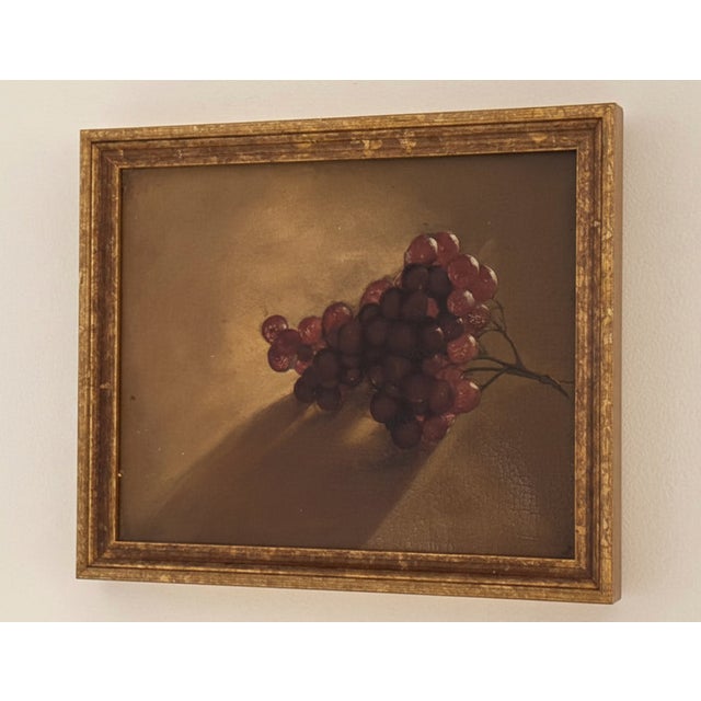 Framed oil on board, depicting a classical realist still life of grapes. This work is rendered with beautiful attention to...