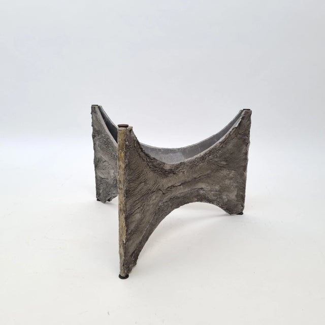 This Brutalist coffee table is made in a style reminiscent of designs by Paul Evans. It was manufactured in Belgium, circa...