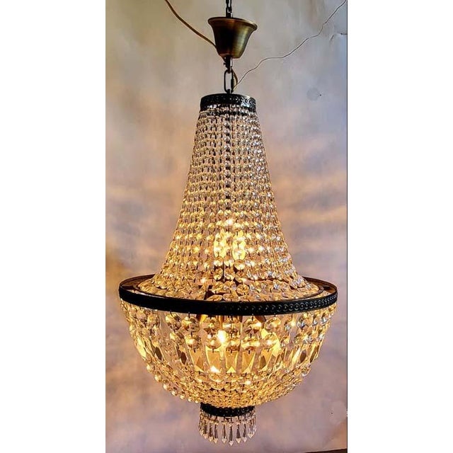 Elegant vintage cut crystal basket chandelier. Note: the color of the metal is gold tone as shown in the lighted version...