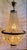 Elegant vintage cut crystal basket chandelier. Note: the color of the metal is gold tone as shown in the lighted version...