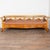 19th century Swedish Karl Johan style bench crafted in glowing birch. The bench features slightly outward curving arms...