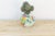 A small vase like this rewards close attention more than a large one ever could. Its round, gourd-like body is hand-...