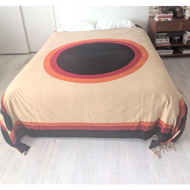 Offered is a woven cotton bed cover with fringe featuring the geometric target motif created by Riten Mozumdar (b. 1927 -...