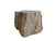 This striking side table is carved from a solid piece of petrified wood and forms part of a set, with the matching piece...
