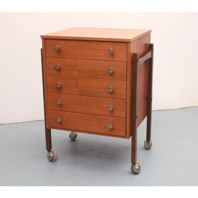 1960s trolley / utensil. Body veneered in walnut. with 5 drawers, interior height 6cm. Freely adjustable in the room. Very...