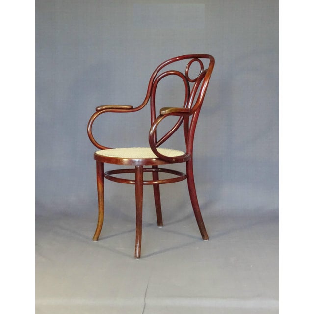 Very good original condition under original mahogany brown chelack. Recent 6-strand hand caning. This piece has an...
