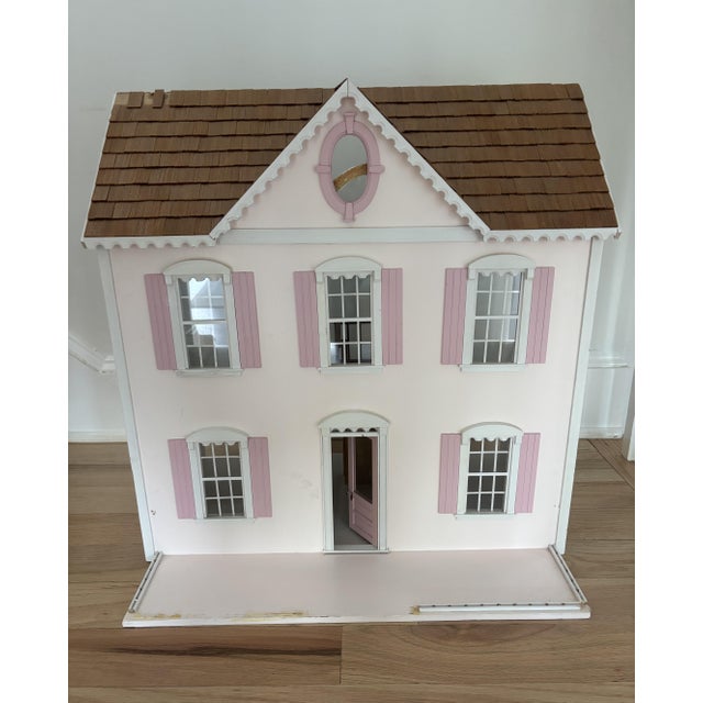 True vintage doll house made of real wood with cedar roof shingles (several missing). This doll house dates back to the...