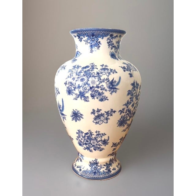 Vintage Blue & White Floral & Bird Vase A beautiful, vintage light blue‑and‑white porcelain vase decorated with detailed...