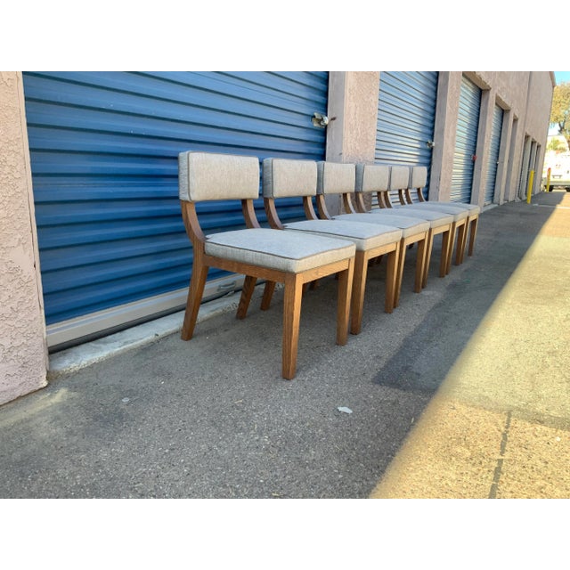 Modern set of oak dining chairs. The set is newly upholstered. The wood is solid oak. The chairs are well made.