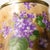 a Royal Munich backstamp. This backstamp dates the biscuit jar from 1900 to 1930. The biscuit jar is painted brown with...