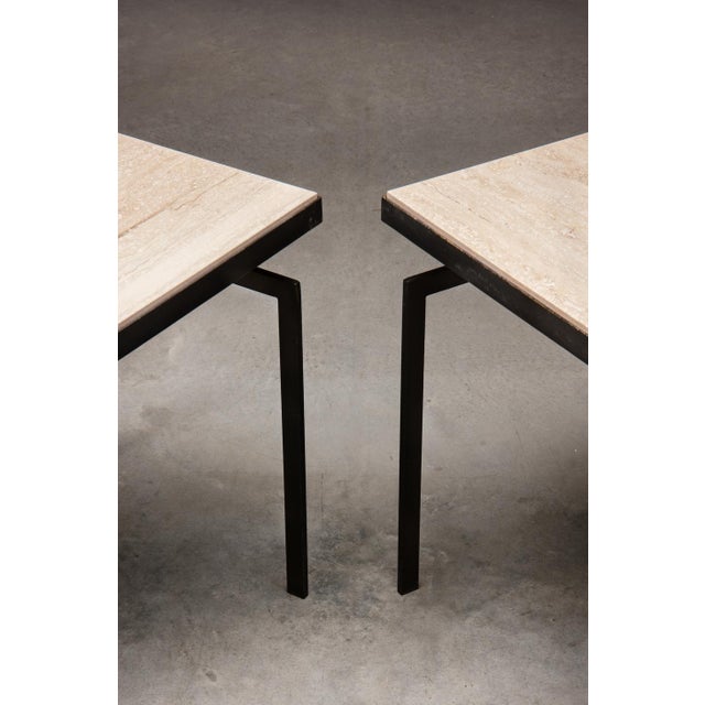 A rare pair of Belgian modernist tables in matt black lacquered flat metal profile with travertine top. In the late 50s,...