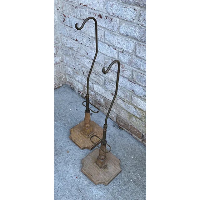 Vintage pair of brass and wood hat display or jewelry display on carved wood bases. Patina on the brass is gorgeous. Both...