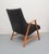 Unusual 50s armchair. Construction made of solid cherry wood. New reference to Velour in the color of antrazith. The...