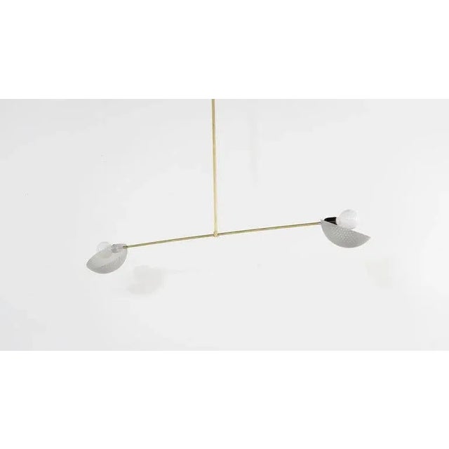 The Axial pendant is a ceiling fixture with a strong modern design defined by balance and equilibrium. Axial features two...