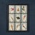A stunning collection of antique pressed flowers and herbs, each preserved and labeled with handwritten botanical names....