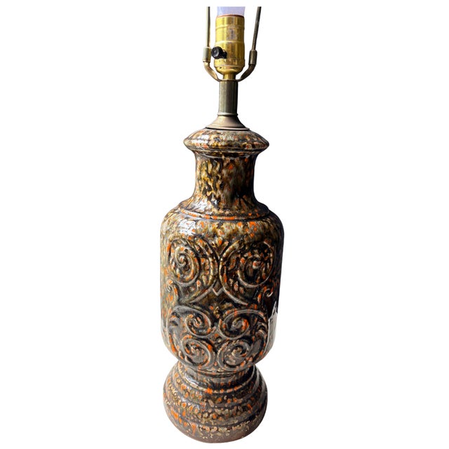 A striking and highly collectible West German Fat Lava ceramic table lamp dating to the 1960s and 1970s. The urn-shaped...