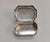 Found among a multigenerational silver collection, this decorative silver-tone box features clipped corners, flowing...