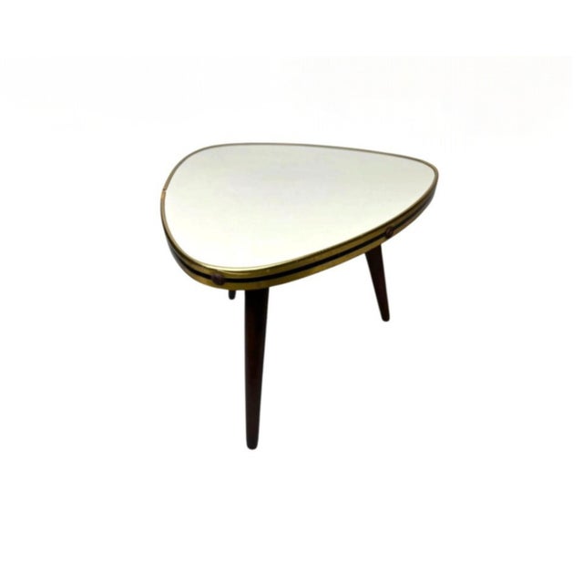 General Authentic vintage occasional table dating from the mid-20th century, circa 1950s. The table features a distinctive...