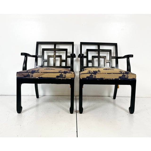 Vintage pair of chinoiserie Ming style arm chairs. Fretwork square backs with ming style legs. Classic Hollywood Regency...