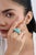 This three-stone cocktail ring features 15.78 carats of natural oval-cut turquoise, set in 18K yellow gold. The design...