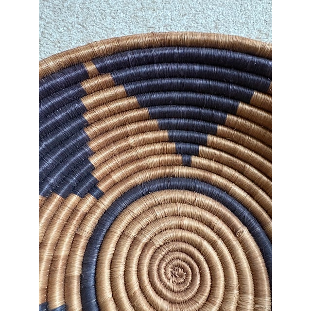 Beautiful, round, hand-made African woven basket black and brown. Decorative and functional. Good condition. Acquired at...