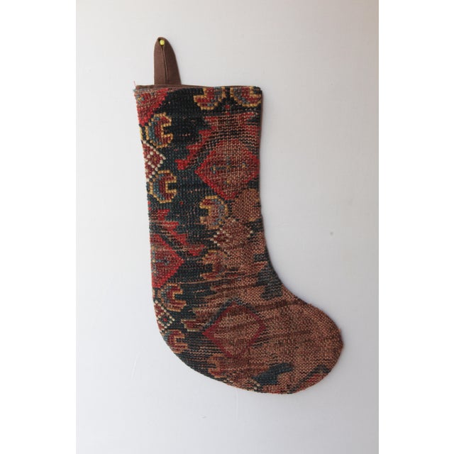 Celebrate the season with this one-of a kind Christmas stocking, handcrafted from a genuine antique tribal rug. Rich in...