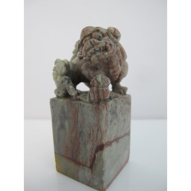 Antique Chinese carved chop seal. Gray and red tone soapstone with intricately carved foo dog at top and seal at base....