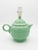 A cheerful matching pair of vintage green ceramic lamps formed as classic teapots, complete with lids, rounded bodies,...
