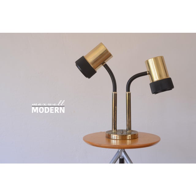 Rare brass double lamp from the 1970s with adjustable black plastic goosenecks that adjust in different positions. Works...