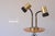 Rare brass double lamp from the 1970s with adjustable black plastic goosenecks that adjust in different positions. Works...
