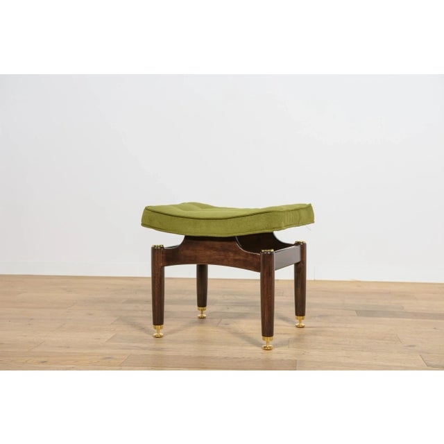 A stool from the Librenza series produced by the British G-Plan factory in the 1950s. A stool with a wooden base made of...