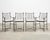 A handsome, iconic set of four bronzed "Montecito" garden counter barstools designed by Michael Taylor. The set features a...