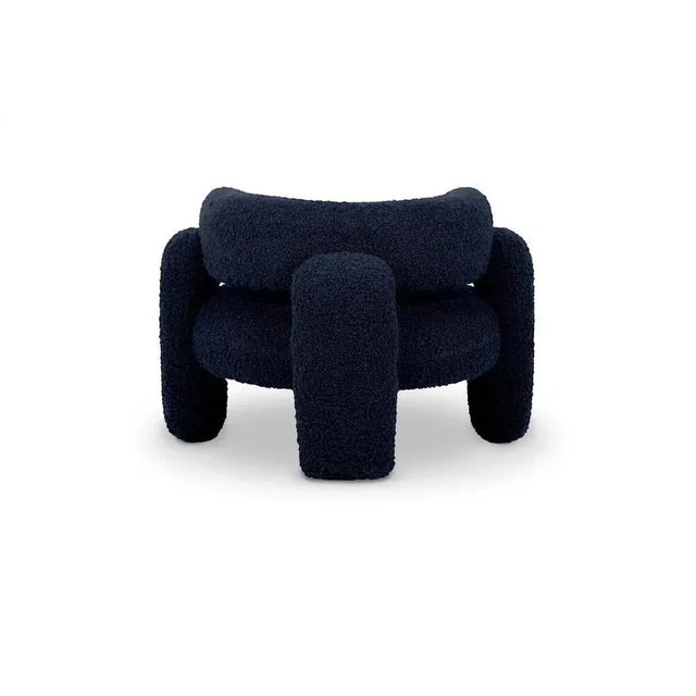 Embrace Cormo Indigo Armchair by Royal Stranger Dimensions: W 96 x D 85 x H 68 cm. Materials: Upholstery. Featuring an...