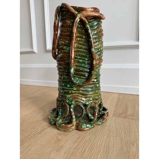 Exceptional signed and dated 1981 studio pottery vessel featuring a bold, handbuilt sculptural form with applied loop...